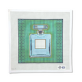 PERFUME BOTTLE ON GREEN