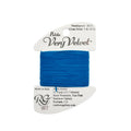 Blue thread on a white card with 'Petite Very Velvet' label