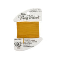 Mustard yellow thread on a white card with brand name, on a light gray background